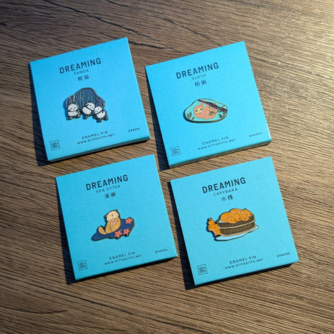 dreaming - sea otter enamel pin